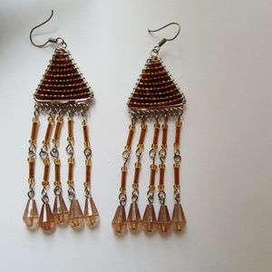 Amber color beaded pyramid triangle drop earrings.
